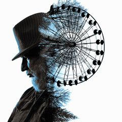 Double exposure. Collage of the man in a hat and review wheels.