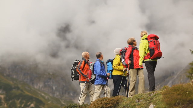 seniors hiking with female guide