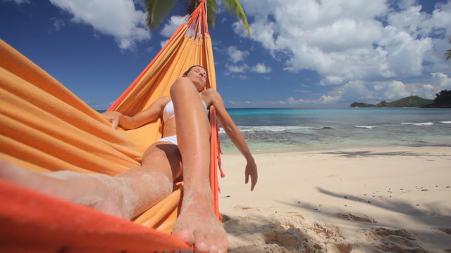 young woman in hammock close wideangle