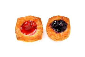 mini raspberry and blueberry danish on white background