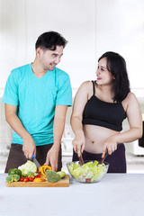 Two couple making salad