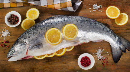 Atlantic Salmon  with lemon on  wooden table.