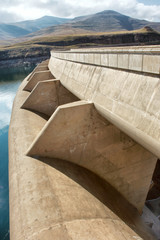 Dam wall against mountains