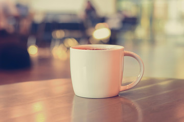 Coffee cup on the table in coffee shop