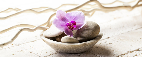 symbols of purity with stones and pebbles in cup
