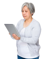 Asian old woman use of tablet