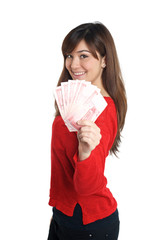 Asian girl holding a few bills of Chinese money