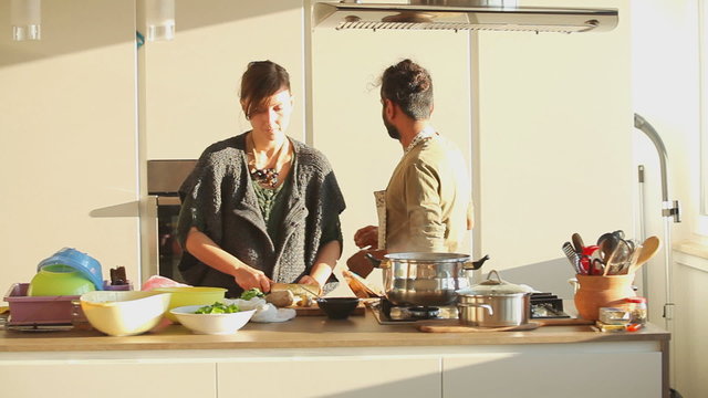 Young couple preparing lunch in the kitchen