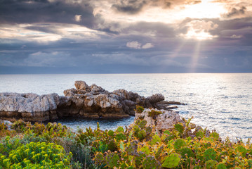 Dramatic spring sunset on the cape Milazzo, nature reserve Pisci