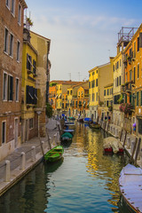 Fototapeta na wymiar yellow sunset on the canal in Venice