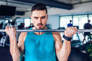 Naklejka premium Crossfit instructor at the gym doing Exercise