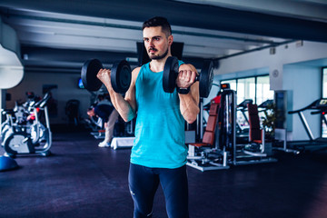 Crossfit instructor at the gym doing Exercise