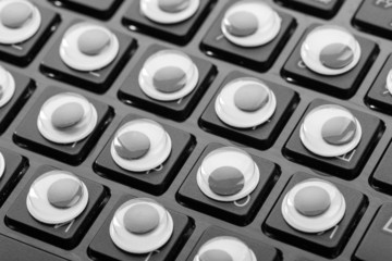 Close up keyboard with eyes instead of buttons