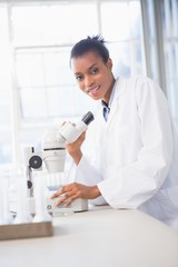 Smiling scientist looking at camera