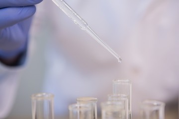 Scientist doing experimentations in tubes