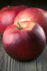 Red apples on wood