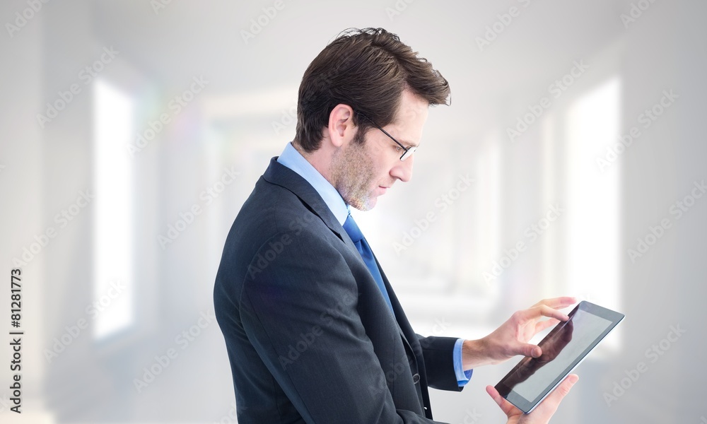 Aufkleber Composite image of businessman standing while using a tablet pc