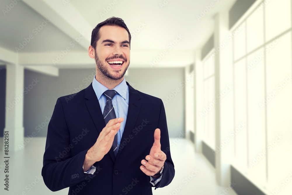 Aufkleber composite image of happy businessman standing and clapping