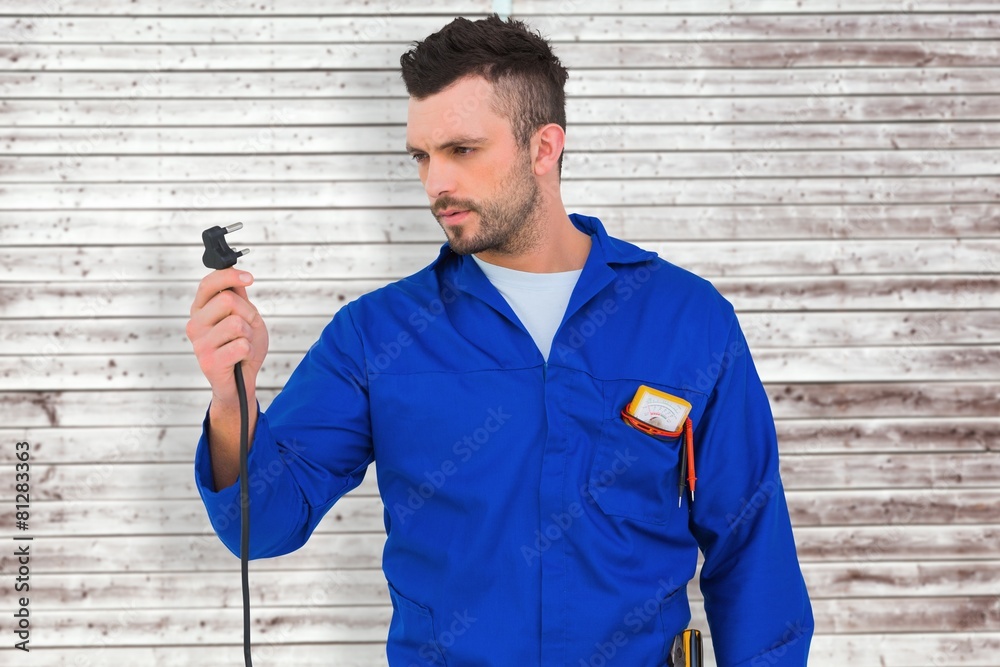 Poster composite image of electrician looking at plug