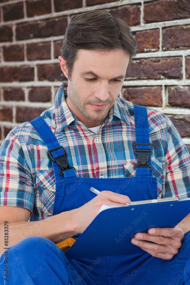 Poster Composite image of plumber writing notes on clipboard