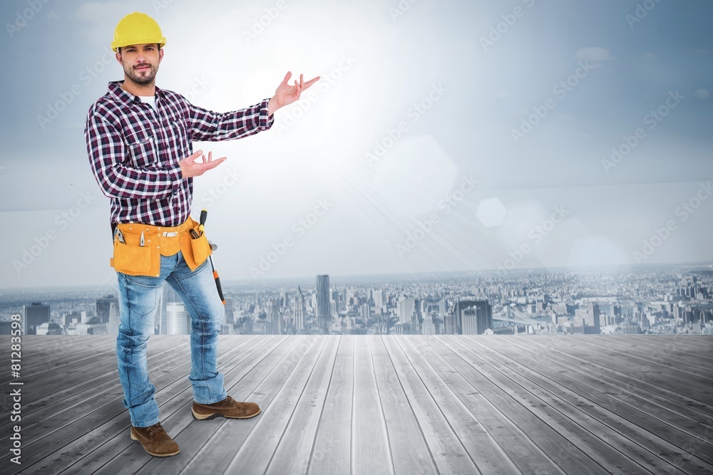 Poster Composite image of handyman showing something