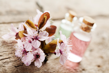 Spa setting with essential oils and flowers