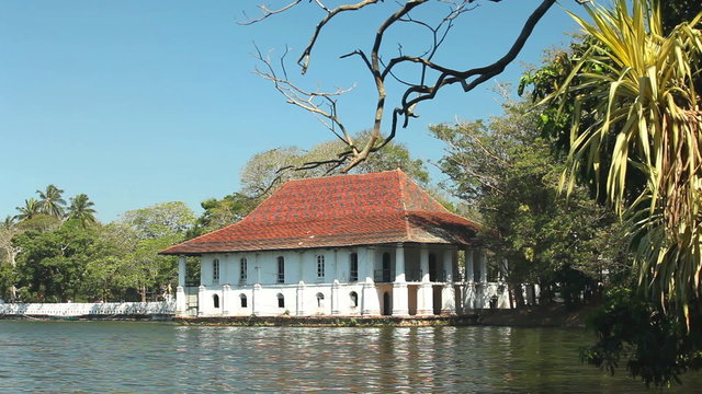KANDY, SRI LANKA - FEBRUARY 2014: View of house on Kandy lake. Kandy is a major city in Sri Lanka, and it is the second largest city in the country after Colombo.