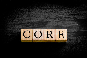 Word CORE isolated on black background with copy space