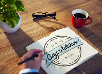 Man with Note Pad and Congratulations Concept