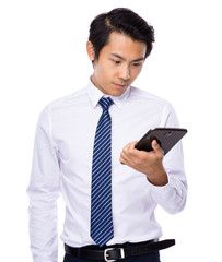 Young business asian man using his tablet