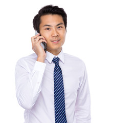 Young asian business man talking on mobile