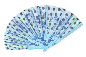Blue polka dot hand fan isolated on white