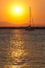 Yacht in the sea at sunset