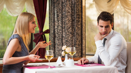 Man is getting bored on first date