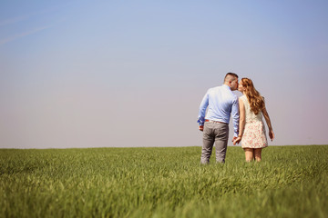 Young couple in green fields