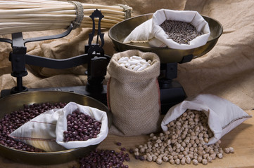 Still life of beans, chick-peas and lentils with ancient scale
