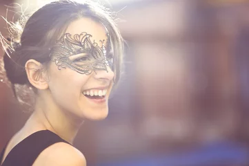 Gordijnen Happy Young Woman with Black Masquerade Mask © guerrieroale