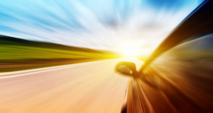 Car On The Road With Motion Blur Background.