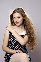 Young long-haired curly blonde woman