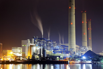 power station at night with smoke