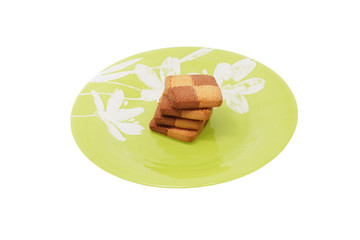 Cookies in the green plate. Isolated.