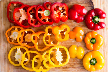 Sliced Red and Yellow Bell Peppers on Wooden Board