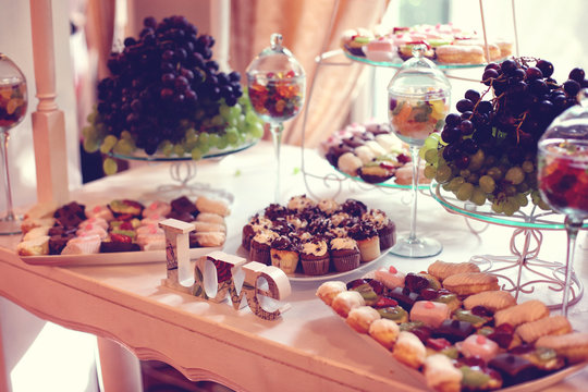 Love Letters Decor On Table With Sweets And Fruits