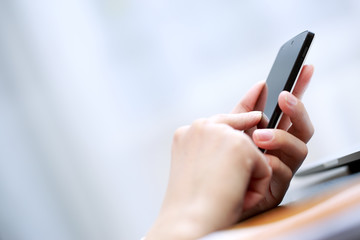 Close up of a woman using smartphone