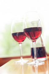 Two glasses of delicious red wine. Vintage filter