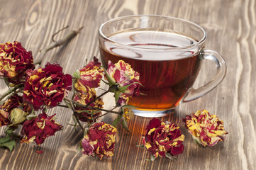 Cup of tea and dry roses