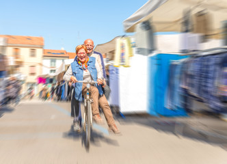 Senior couple on bike