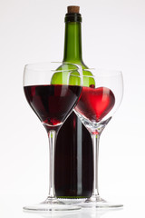 Wine glasses with red wine and heart