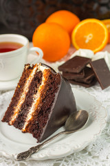 Delicious chocolate cake with cream and fruit