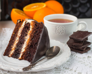 Delicious chocolate cake with cream and fruit